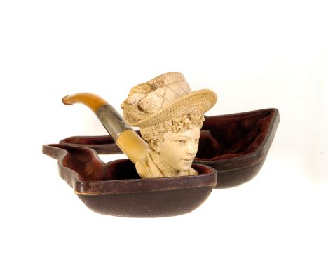 A vintage Meerschaum pipe, carved into the bust of an elegant lady wearing a hat, AF