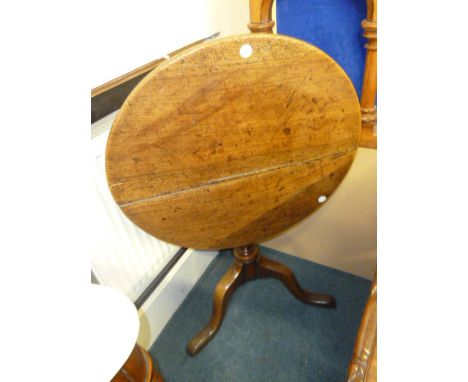 A George III elm snap top breakfast table, on oak tripod base