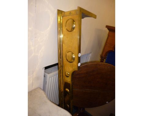 An Arts and Crafts brass fire surround/fender, having raised spherical design to all sides 