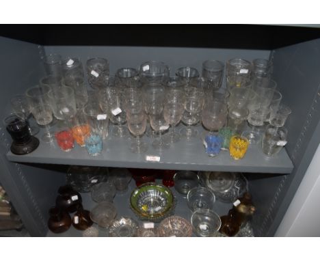 A selection of cocktail wine and party glasses including 50's printed shot glasses