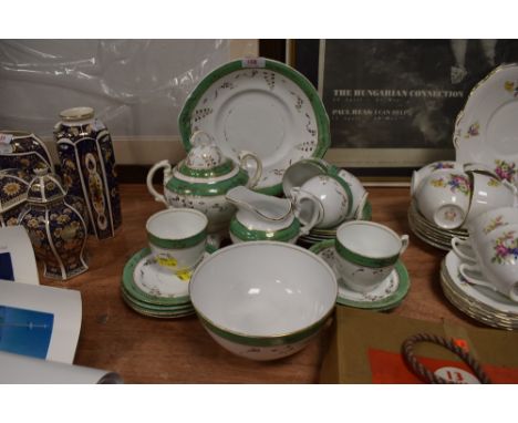 An antique part dinner service having white ground with green banding and gilt floral detailing included are jug,bowl cups an