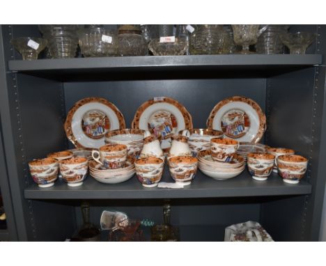 A large antique part tea service having Chinoserie print design with enamel detailing in hard paste ceramic including creamer
