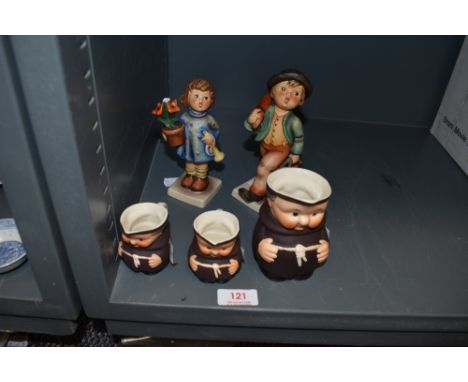 A selection of figurines by Goebel including monk jugs
Girl holding flowers has damage, all other pieces very good condition
