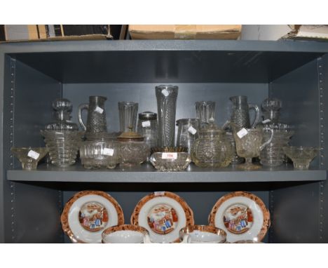 A selection of pressed and clear cut glass wares including light shades claret jug decanter etc