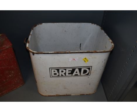 A vintage enamel bread bin with name badge