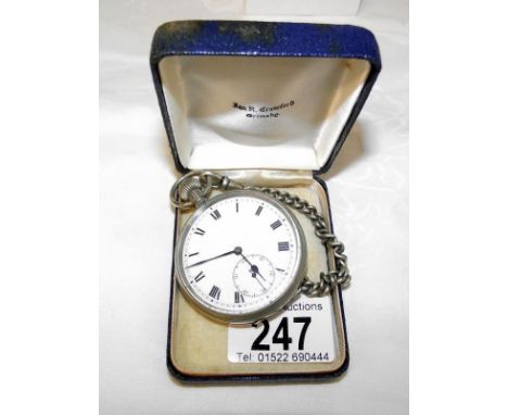 A gents pocket watch on chain in working order*Condition report*Watch runs for short periods, enamel face. Looks in good cond