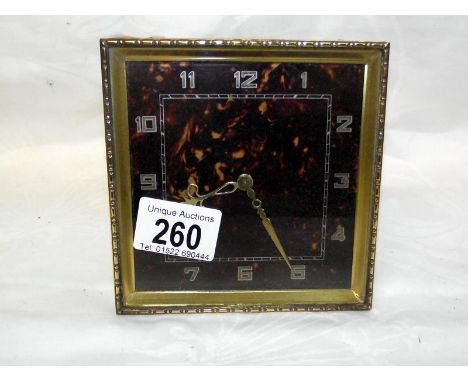 A vintage square style mantle clock in working order