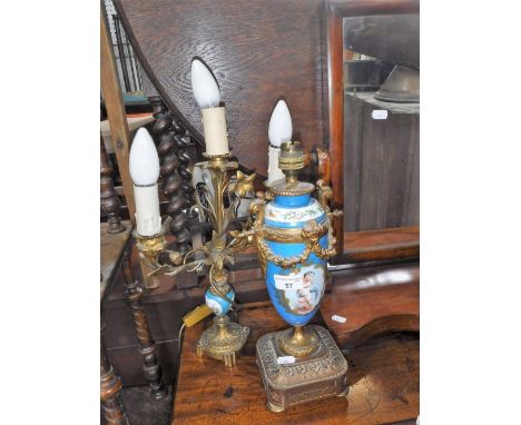 A CONTINENTAL GILT SPELTER TABLE LAMP with cherub decorated ceramic centre and another similar (2)