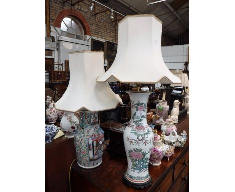 A CHINESE FAMILLE ROSE VASE, decorated with warriors, 36.5 cm high (drilled and converted to a table lamp) and another simila