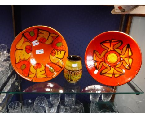 POOLE POTTERY DELPHIS; two red and orange bowls, 27 cm dia. and a vase, 12 cm high