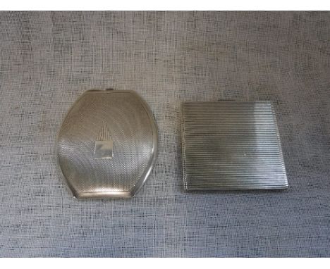 TWO SILVER COMPACTS with engine-turned decoration