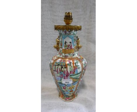 A CHINESE FAMILLE ROSE VASE with panels decorated with figures in traditional costume (drilled and converted to a table lamp)