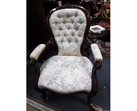 A VICTORIAN WALNUT BUTTON-BACK ARMCHAIR with open arms and show wood frame
