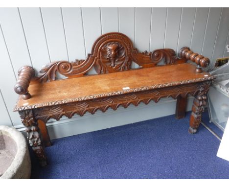 A VICTORIAN CARVED GOLDEN OAK HALL BENCH, 122 cms long