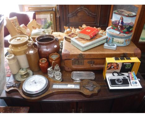 A BAROMETER, a Vintage suitcase, tins, a camera, stoneware and sundries