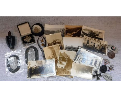 A WORLD WAR TWO "BOMB" FLIGHT, converted to a lighter, a pair of German pliers stamped with a Swastika, similar badges, postc