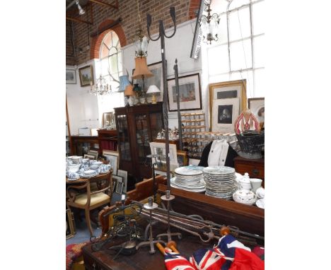 A LARGE WROUGHT IRON "RUSH" LAMP, a pair of iron candlesticks and similar metalware
