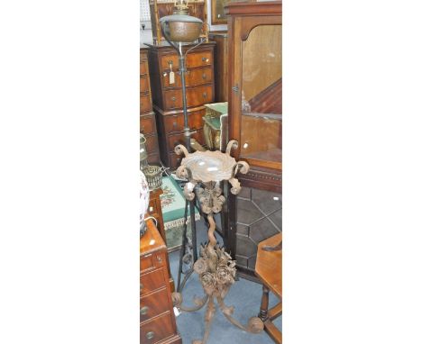 A WROUGHT IRON STAND decorated with flowers and a similar standard lamp (2)