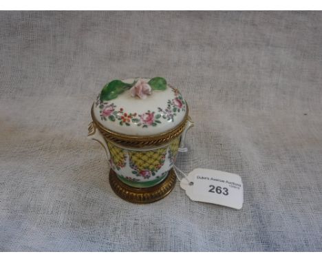 A CONTINENTAL CERAMIC INKWELL with brass mounts, 8.5 cm high