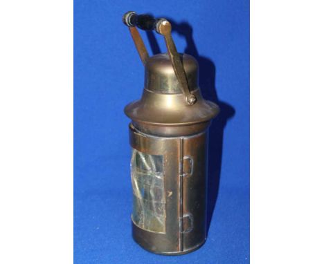 EARLY 20TH CENTURY BRASS MINERS LAMP
with ceramic wick mount with makers stamp, single glazed door, 27cm high