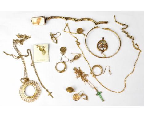 A collection of 9ct gold jewellery comprising a bangle with dolphin finials, a full sovereign pendant mount on a chain, a jad