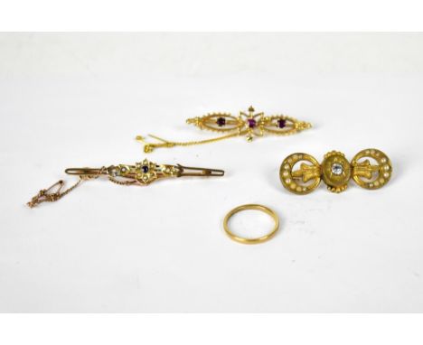 A 15ct yellow gold bar brooch, floral set with small sapphires and seed pearls, approx 3.3g, a yellow metal bar brooch, flora