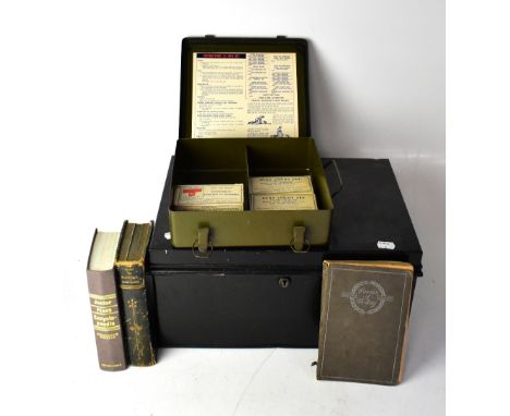 A WWII US Army Medical Department First Aid kit contained in a military green metal box, with original bandages and forceps, 