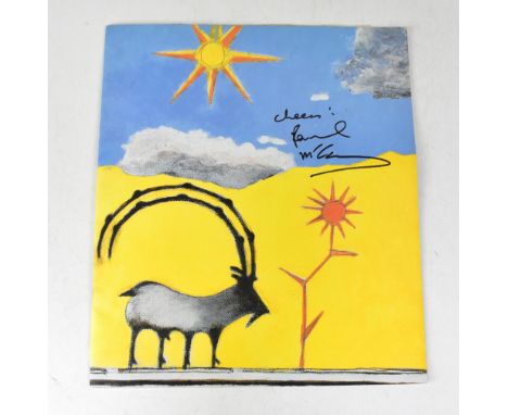 SIR PAUL MCCARTNEY; 'The Art of Paul McCartney', bearing the superstar's signature, along with launch invite (2).We have not 