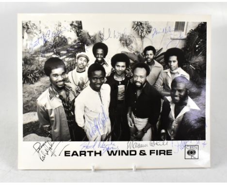 EARTH WIND AND FIRE; a promotional black and white photograph bearing numerous signatures and a type written biography bearin