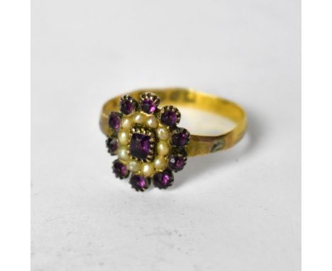 A Victorian 18ct yellow gold ladies' dress ring, floral set with central amethyst, with pearl and amethyst surround, size O, 