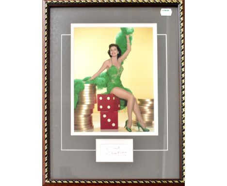 CYD CHARISSE; a colour photograph of the star with signed slip of paper to the margin bearing the star's autograph, 40 x 30cm