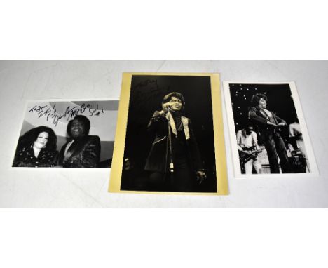 JAMES BROWN; three black and white photographs, each bearing the star's signature (3).We have not authenticated these signatu