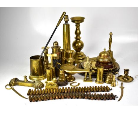 A small quantity of brassware to include oil lamps, vases, plates etc, mostly with incised decoration, also a trench art tabl