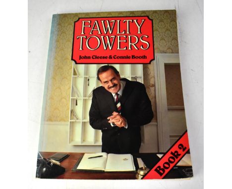 FAWLTY TOWERS; 'Fawlty Towers' a book by John Cleese and Connie Booth, bearing the signatures of the cast.We have not authent