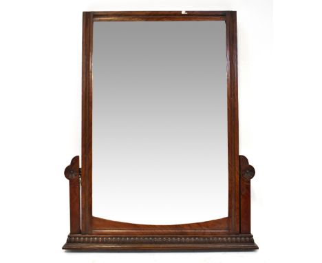An Edwardian mahogany framed swing dressing chest mirror converted to a wall-hanging mirror, with rectangular bevelled glass 