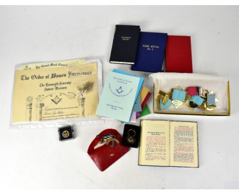 A collection of Masonic jewels and regalia relating to the Order of Women's Freemasons, including a yellow metal square and c