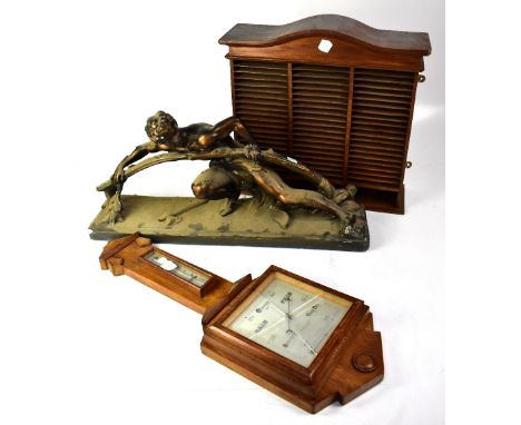 A Lancaster & Thorpe Ltd mid-20th century barometer, with square silvered dial and thermometer above, mounted on an oak base,