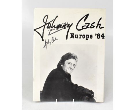 JOHNNY CASH; a 1984 tour programme bearing the star's signature and the signature of June Carter Cash.We have not authenticat