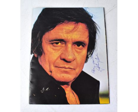JOHNNY CASH; a European Tour 1984 programme bearing his signature.We have not authenticated this signature, please satisfy yo