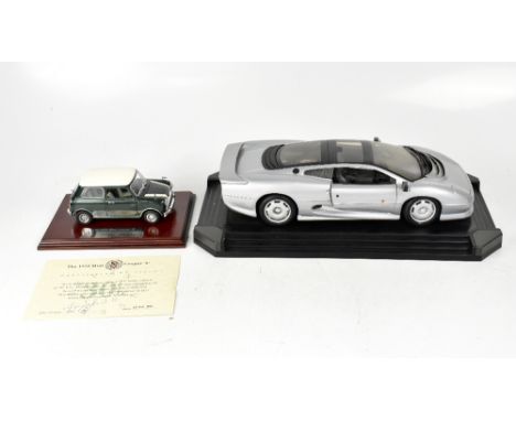 MAISTO; a 1:12 scale model Jaguar XJ220 1992, boxed, together with a model of a 1275 Mini Cooper S, with signed certificate o