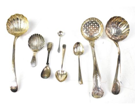 A small quantity of Georgian and Victorian hallmarked silver, to include a sifting spoon, a pair of Victorian shell-shaped se