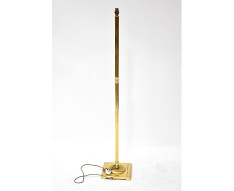 A contemporary brass standard lamp with reeded column on square section base, height 137cm. CONDITION REPORT: Sold electrical