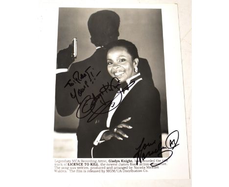 GLADYS KNIGHT; a black and white promotional 007 photograph bearing her signature and that of producer Narada Michael Walden,