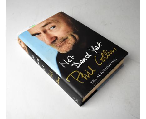 PHIL COLLINS; 'Not Dead Yet' autobiography, bearing the star's signature.We have not authenticated this signature, please sat