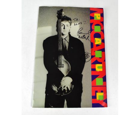 SIR PAUL MCCARTNEY; a World Tour 1989/90 programme bearing the megastar's signature with a doodle to the front cover, with a 