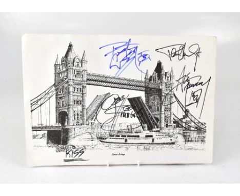 KISS; a black and white print of Tower Bridge bearing the band's signatures.We have not authenticated these signatures, pleas