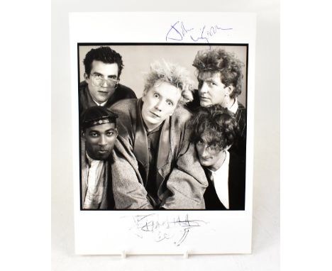 PUBLIC IMAGE; a black and white promotional photograph bearing the twin signatures of Johnny Rotten.We have not authenticated