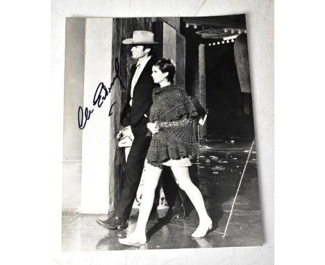 CLINT EASTWOOD; a black and white photograph bearing his signature, 25.5 x 20cm.We have not authenticated this signature, ple