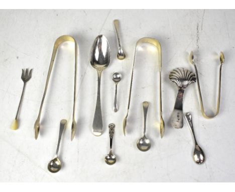 Two pairs of hallmarked silver sugar tongs, a shell-form caddy spoon, various salt and mustard spoons, etc, various dates and