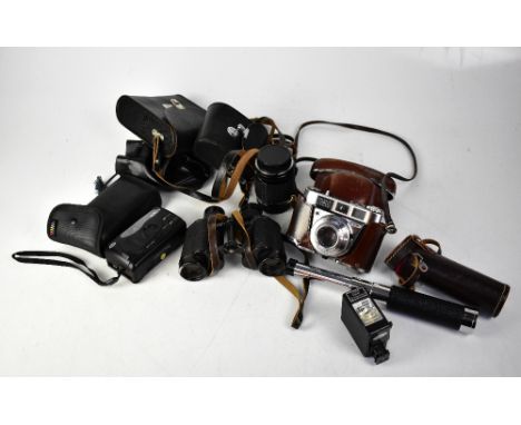 A collection of cameras and camera accessories to include a Kodak Retinette IB, a pair of Soviet binoculars and a Pentax Taku